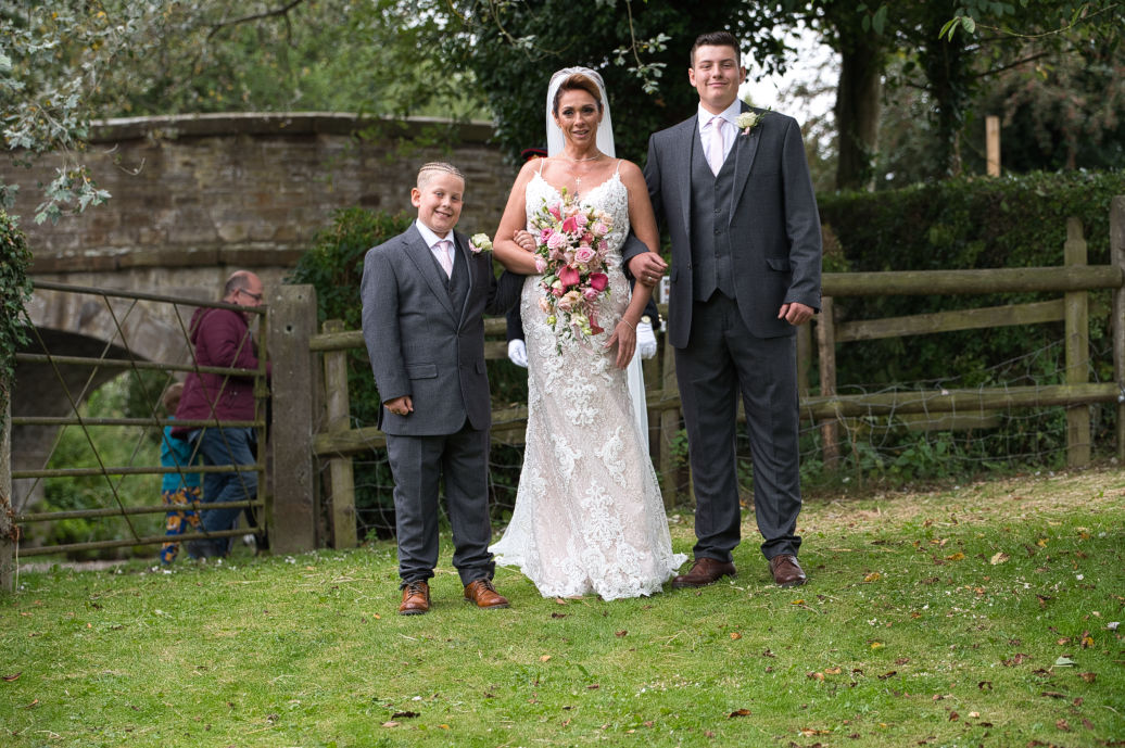 Genuine moments with a bride and her two sons from a micro wedding at Lyme Breeze Weddings