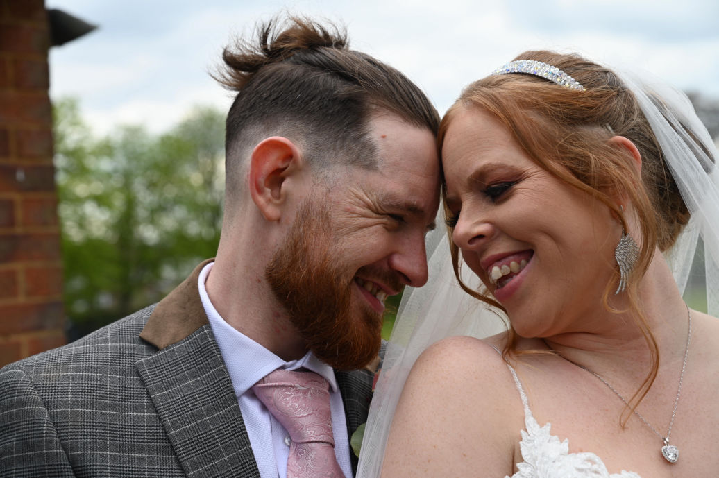Bride and groom embracing after intimate wedding ceremony