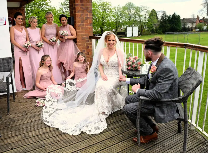 bride, groom, and bridesmaids at romiley cricket club