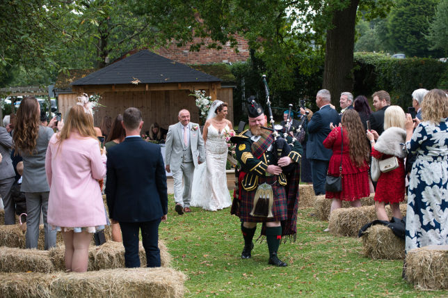The blinding room is bagpipe back down the aisle on the outside wedding at lyme Breeze wedding venue Macclesfield