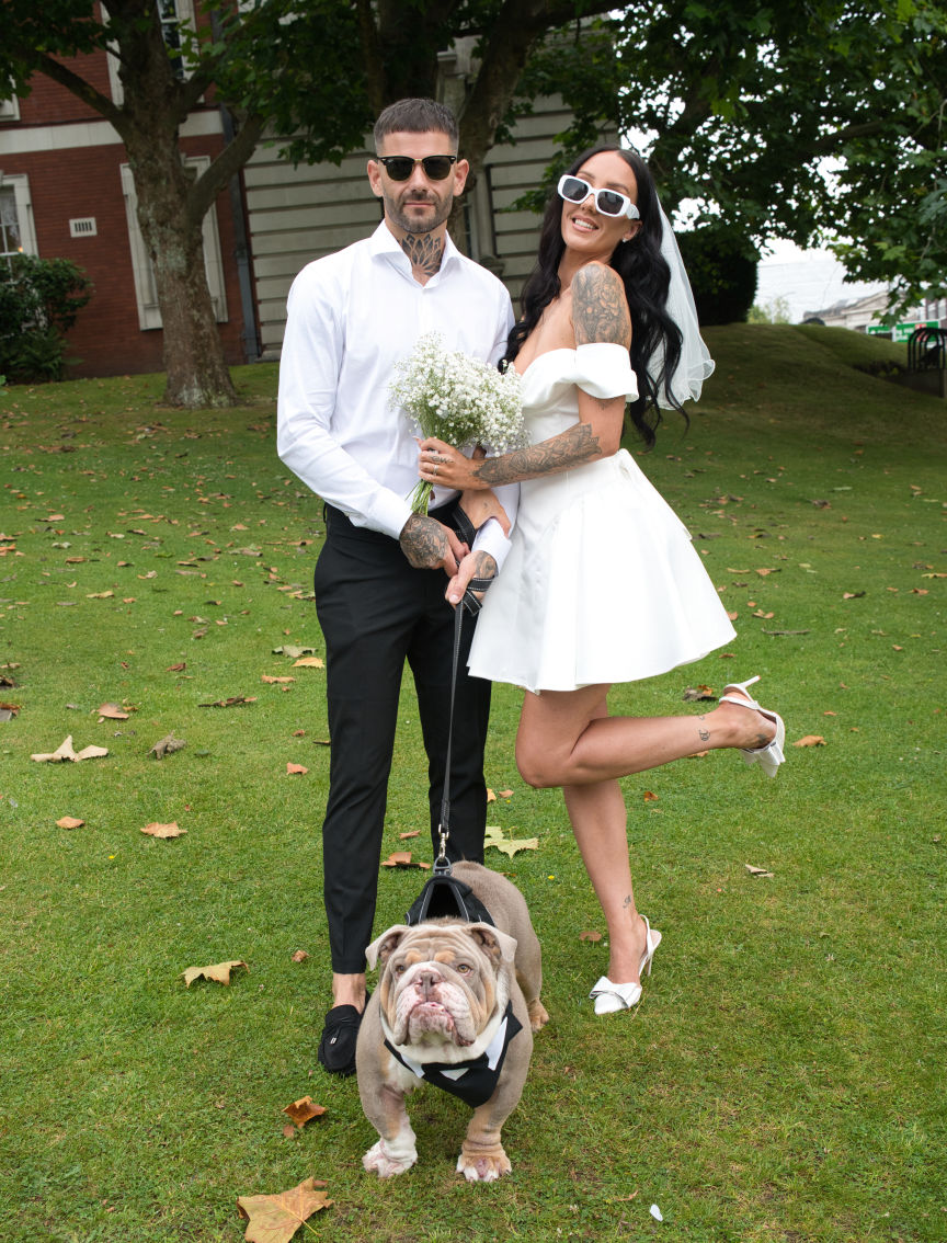 Bride  and groom with there dog at there wedding
